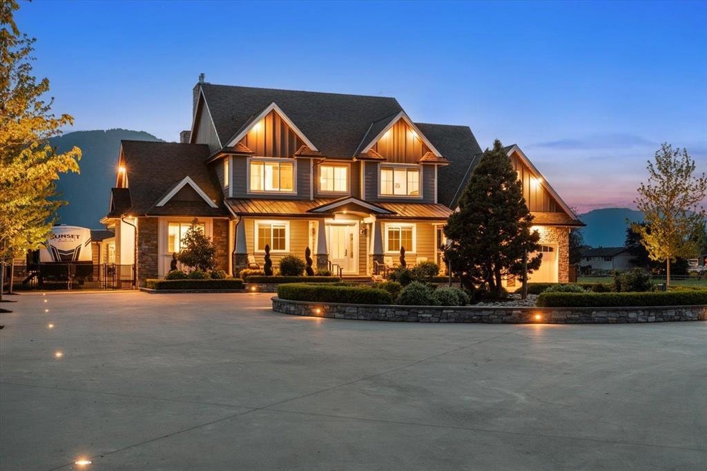 Twilight exterior of the craftsman-style estate at 6257 Sumas Prairie Road, Greendale, Chilliwack